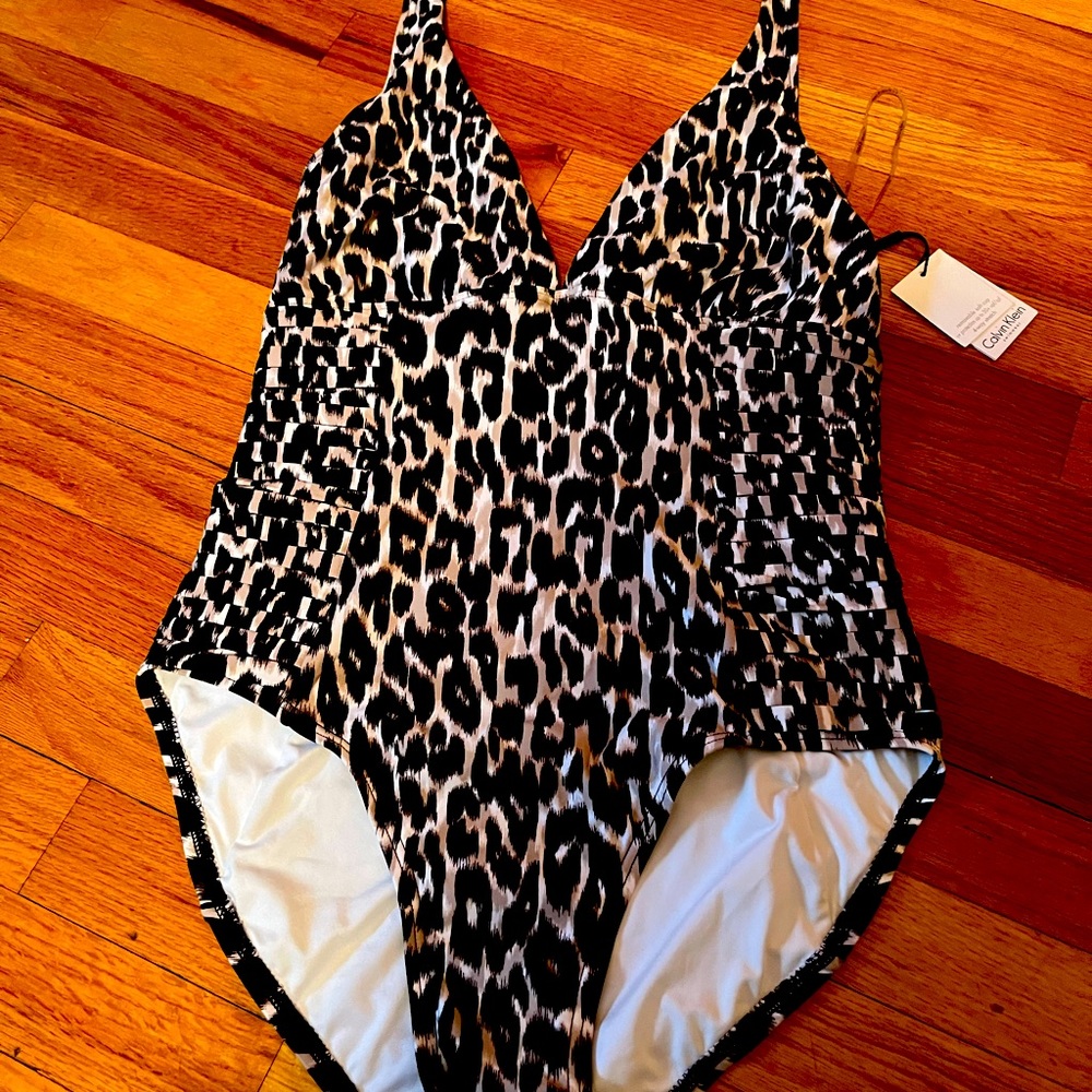 Calvin Klein Leopard Swim Suit. New with Tags. Size 10 excellent condition.
